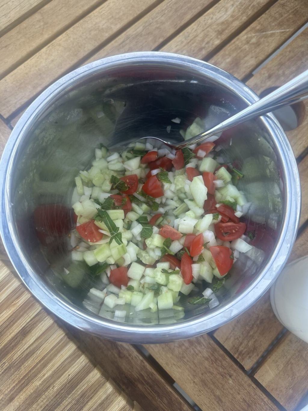 Fresh cucumber, tomato, onion and mint salad.