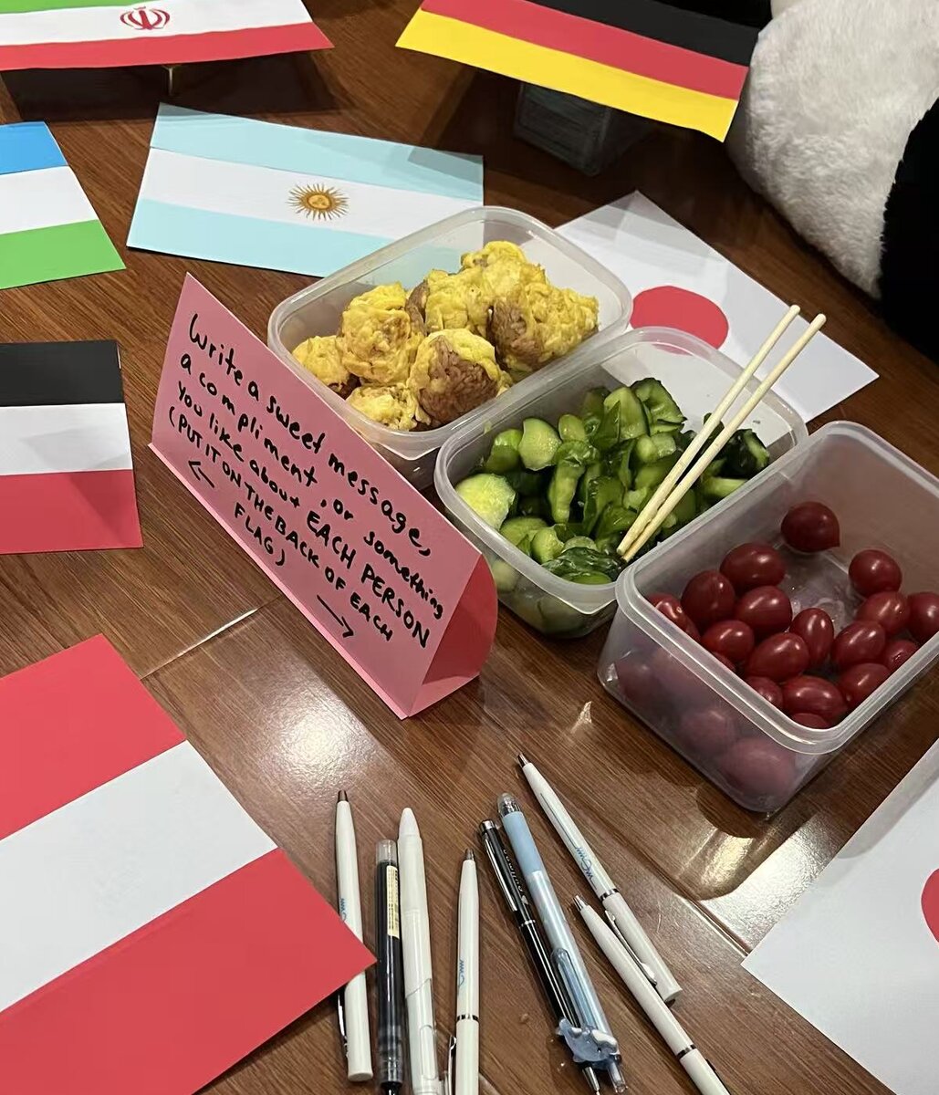 Food, handmade country flags and a note inviting friends to write kind messages